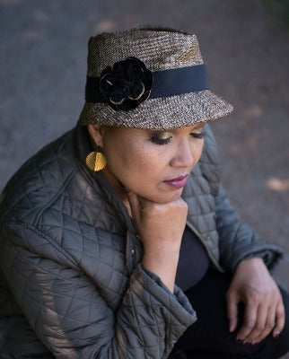 Woman wearing Olivia Fedora Hat in Liam Upholstery with Custom Velvet Flower Brooch | Handmade in Seattle WA | Pandemonium Millinery