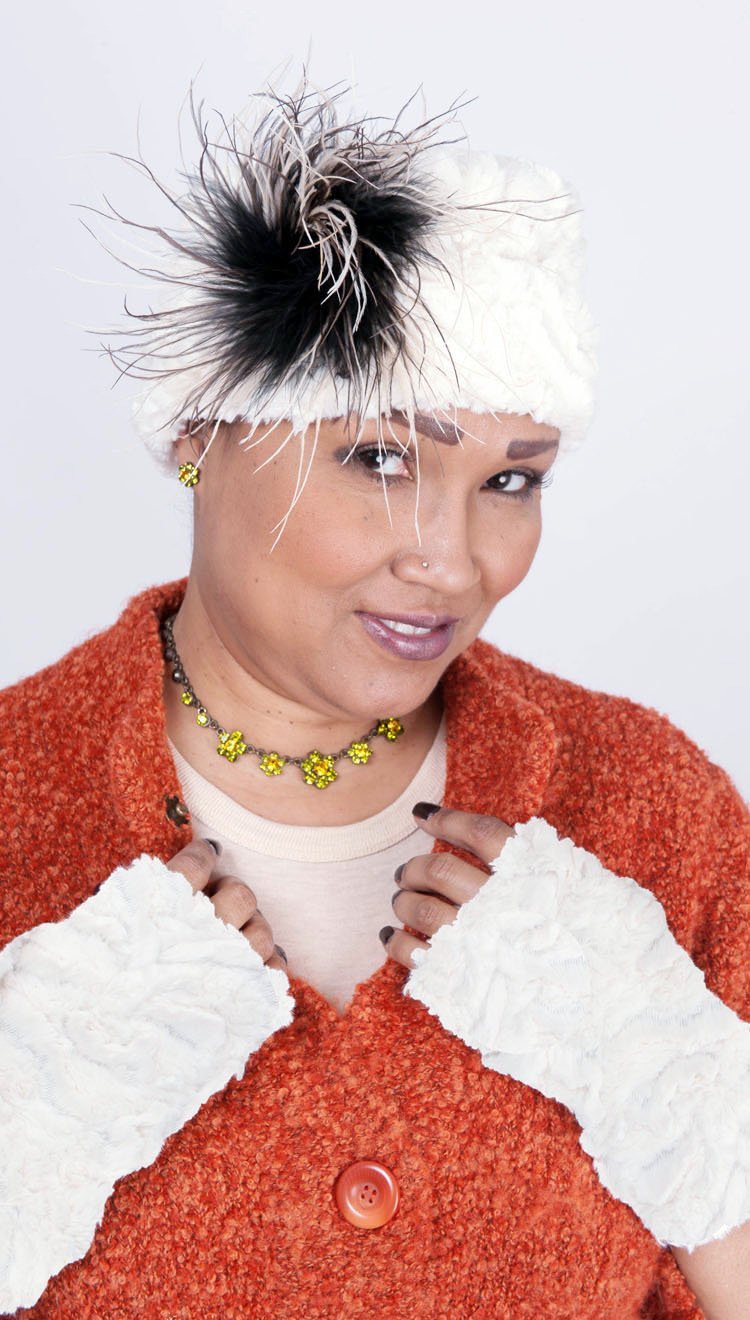 woman wearing faux fur pillbox with Ostrich Feather Brooch in Black Cream and Brown | Handmade in Seattle WA | Pandemonium Millinery