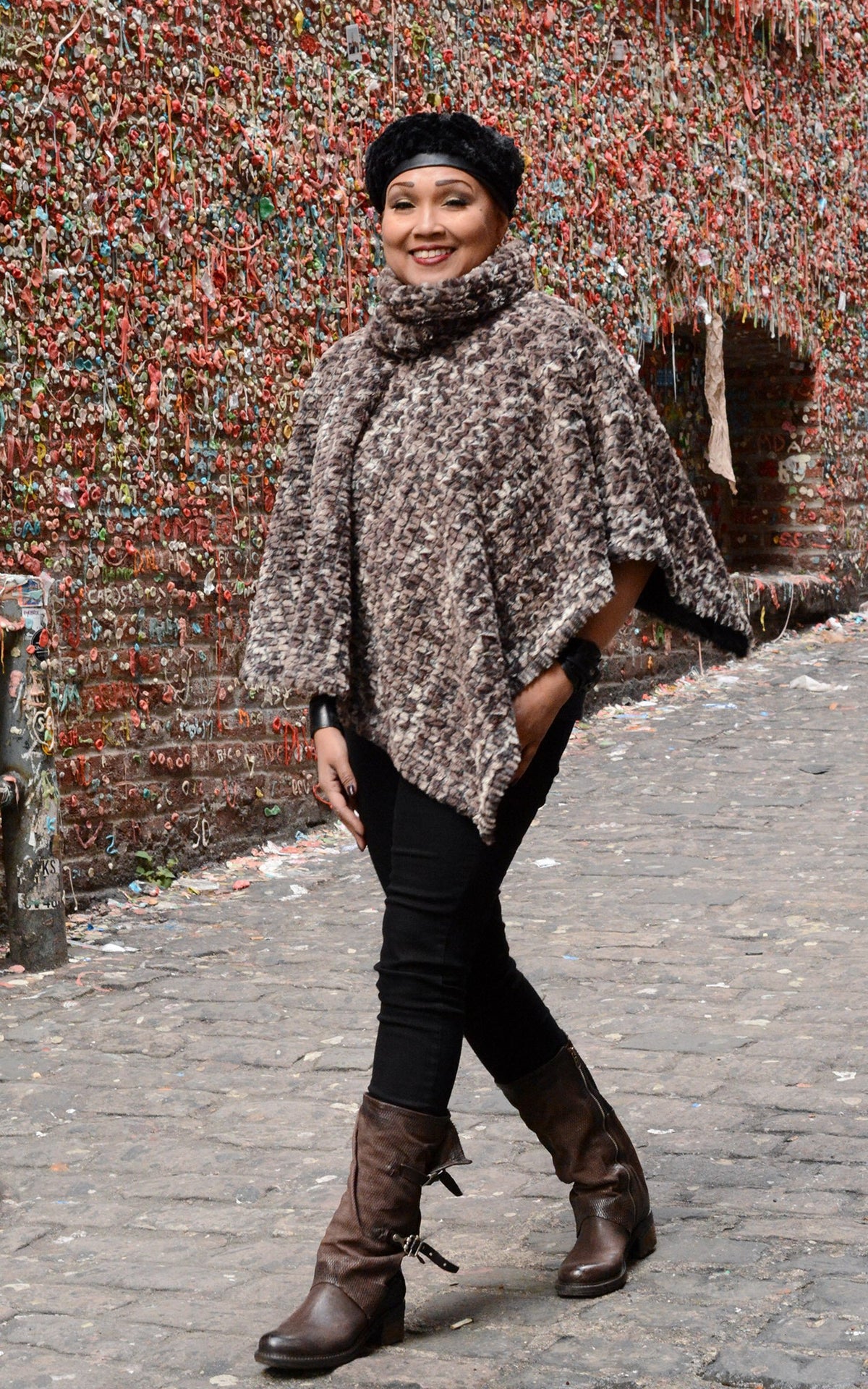Model walking next to a Gum Wall  in Faux Fur Beret wearing a Satin Lined Poncho | Calico Brown and Cream Faux Fur | Handmade Seattle WA USA by Pandemonium Millinery