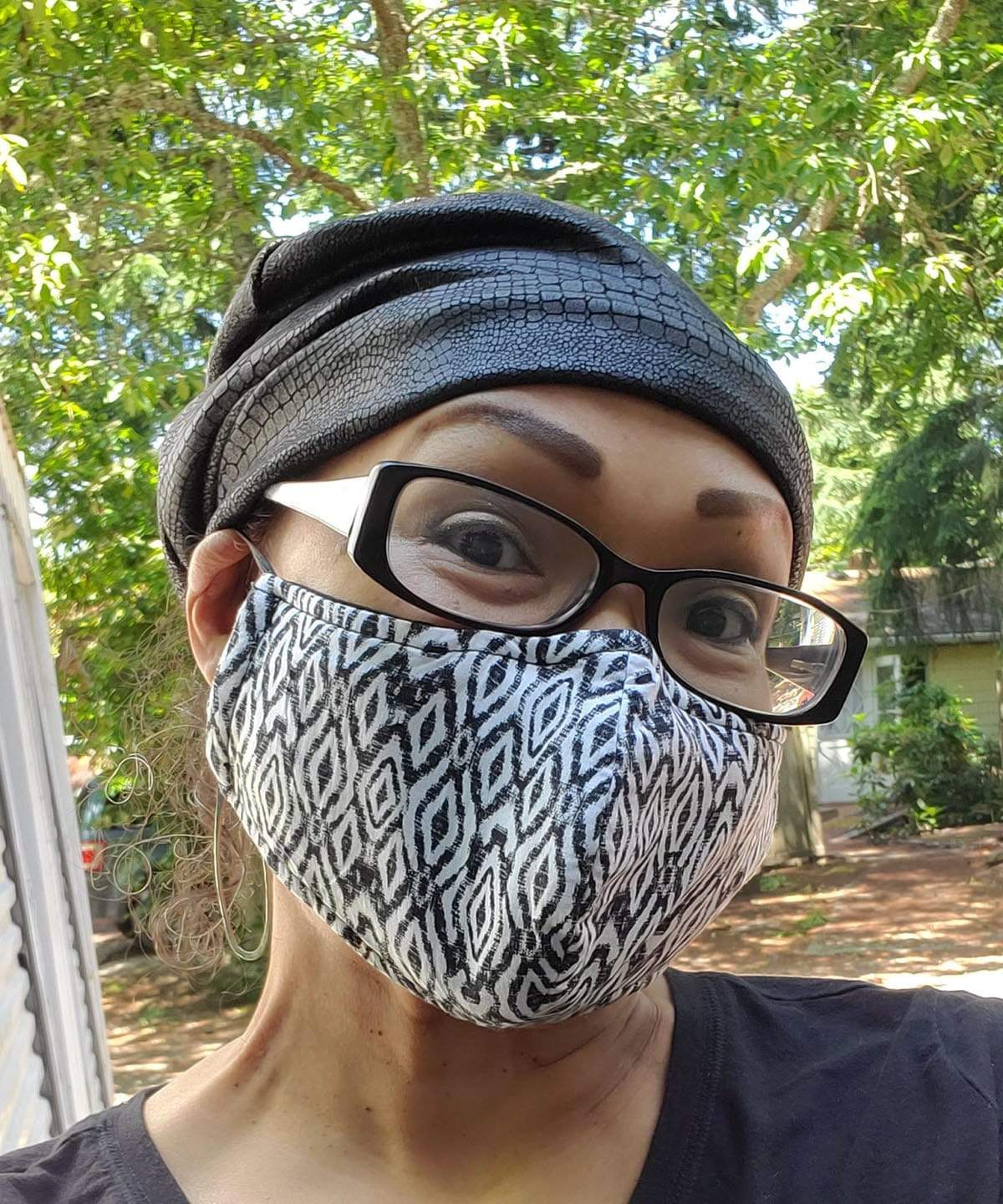 Model in Face mask wearing Rowdie Hat in Outback Faux Leather  | Pandemonium Seattle