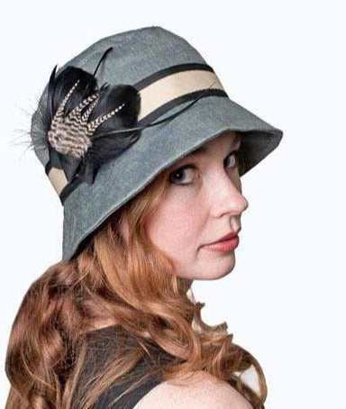 Model wearing Samantha Hat Linen in Juniper |  Beige and Black Band featuring Grizzly Feather Brooch | Handmade By Pandemonium Millinery | Seattle WA
