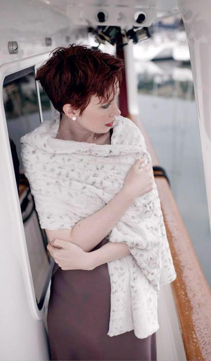 Model on a boat wearing is a Stole | Winter Frost ,  White with  hints of Black Faux Fur | By Pandemonium  Millinery | Seattle WA USA