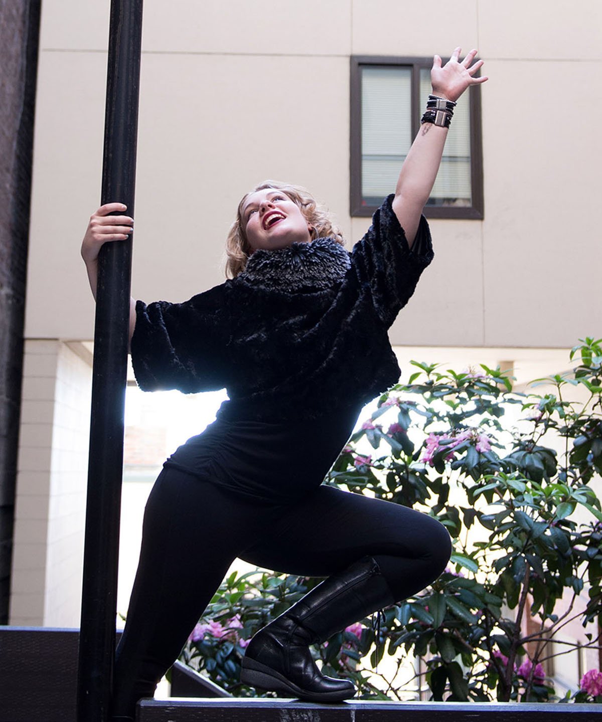 Modeling holding post and reaching to sky while wearing a Sweater Top | Cuddly Faux Fur Black with Silver Tip Fox in Black Faux Fur Long Hair Collar | Handmade By Pandemonium Millinery | Seattle WA USA