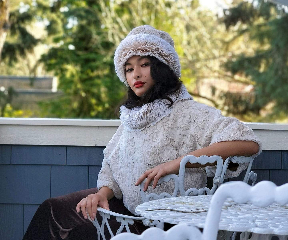 Woman sitting in a chair wearing Sweater Top with Matching Beanie Hat | Cuddly Sand  Faux Fur with Foxy Beach Collar  | Handmade By Pandemonium Millinery | Seattle WA USA