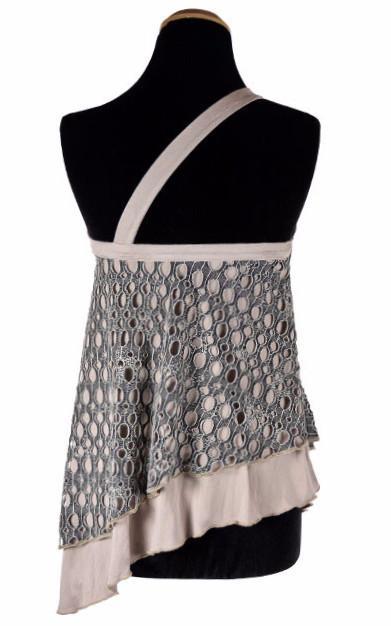 Back View of Product shot of Swing Top an asymmetrical top| Lunar Landing, a black and neutral knit with curled edges surrounding holes paired with a lightweight Jersey Knit in Tan | Handmade in Seattle WA | Pandemonium Millinery