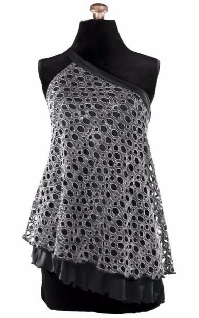 Product shot of Swing Top an asymmetrical top| Lunar Landing, a black and neutral knit with curled edges surrounding holes paired with a lightweight Jersey Knit in Black | Handmade in Seattle WA | Pandemonium Millinery