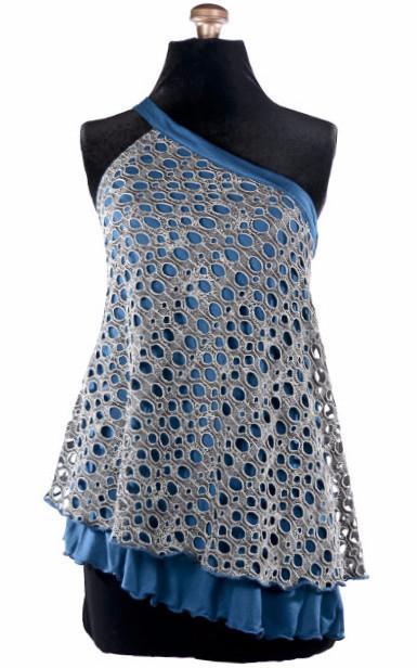 Product shot of Swing Top an asymmetrical top| Lunar Landing, a black and neutral knit with curled edges surrounding holes paired with a lightweight Jersey Knit in Blue | Handmade in Seattle WA | Pandemonium Millinery