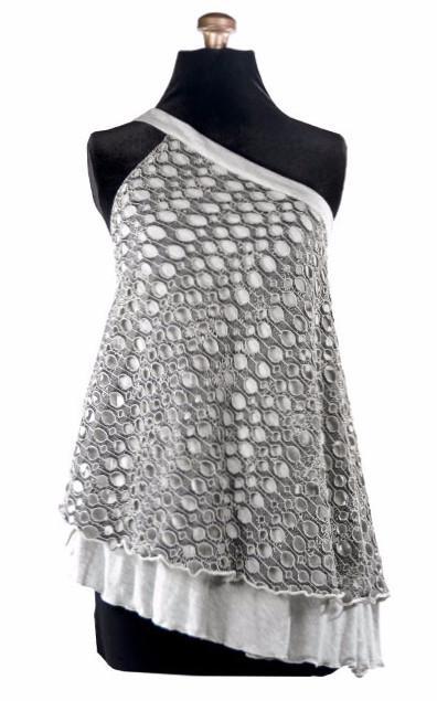  Product shot of Swing Top an asymmetrical top| Lunar Landing, a black and neutral knit with curled edges surrounding holes paired with a lightweight Jersey Knit in Silver Gray | Handmade in Seattle WA | Pandemonium Millinery