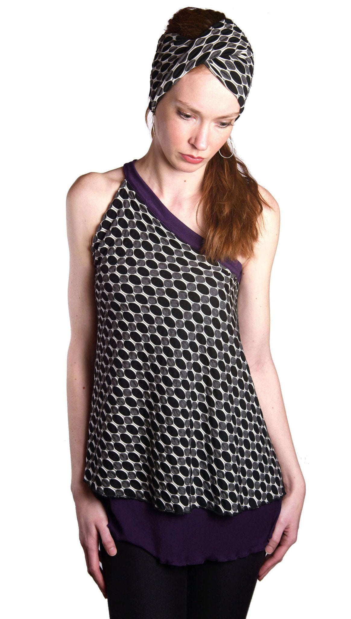 Model wearing headband and matching Swing Top an asymmetrical top| Solar Eclipse a textured knit of black grays and whites paired with Jersey Knit in Purple | Handmade in Seattle WA | Pandemonium Millinery