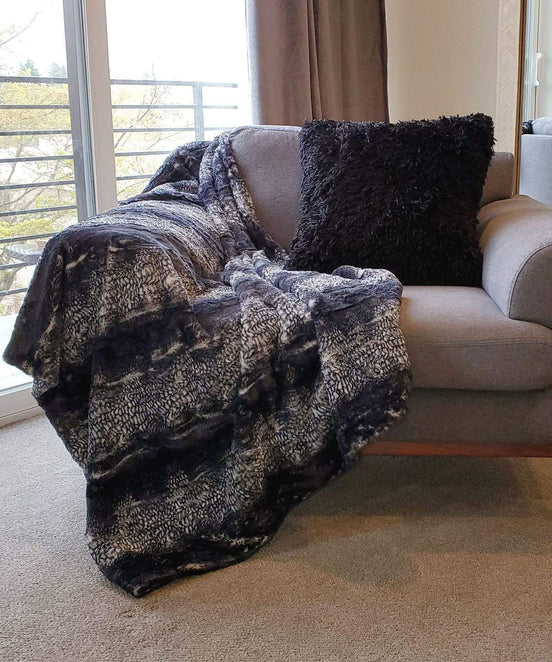 Black Mamba on Chair with Pillow | Luxury Faux Fur Throws | Pandemonium Millinery