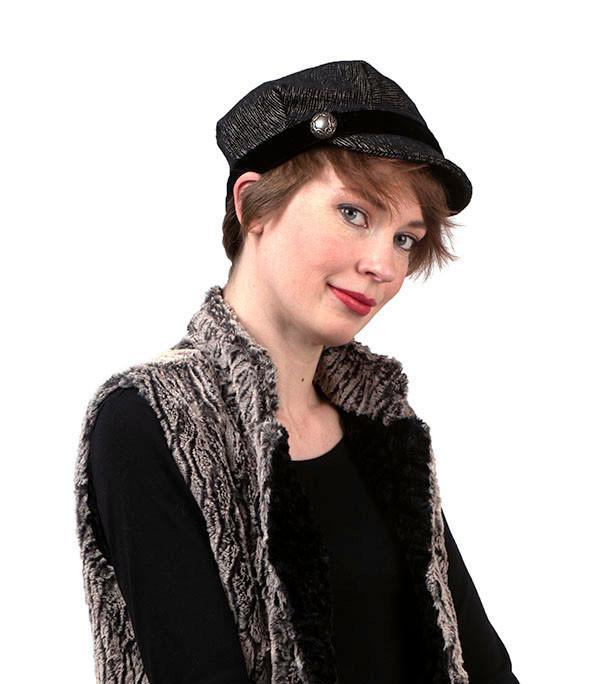 Model in Faux Fur Vest wearing Valerie Cap Style | Bongo Black Beige Upholstery Fabric | Round Metal Button with Black Velvet Band | Handmade in Seattle WA USA |Pandemonium Millinery |