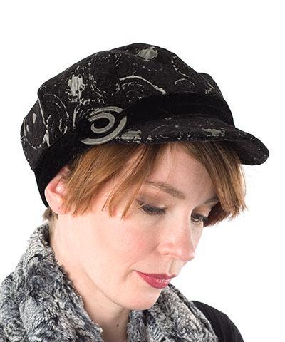 Model wearing Pandemonium Millinery | Valerie Cap Style | Crop Circle Upholstery Fabric | Spiral Metal Button Trim | Handmade in Seattle  WA  USA
