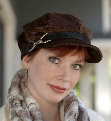 Woman wearing Valerie Newspaper Boy Style Hat with Buckle Trim | Cohen in Chocolate Upholstery| Handmade by Pandemonium Millinery | Seattle WA