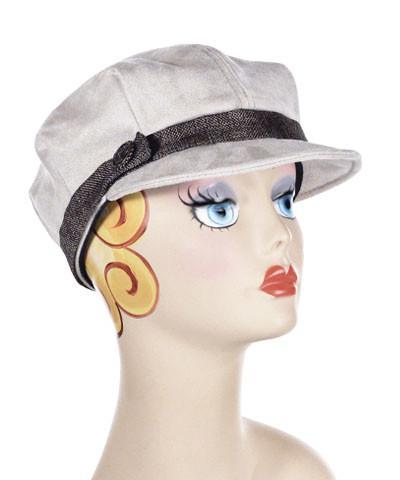 Woman wearing Valerie Cap in Silver Faux Suede with Origin Linen Band | Small Metal Button Trim | Handmade by Pandemonium Millinery | Seattle WA USA