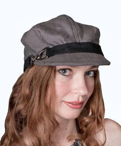 Model wearing a Valerie Cap in Gray Linen with Black Linen Band | Nickel Buckle Trim | Handmade by Pandemonium Millinery | Seattle WA USA
