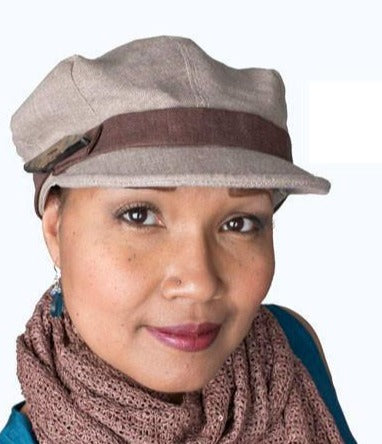 Model wearing a  Valerie Newsboy Hat | Linen in Natural | Chocolate Band with Button Trim| Handmade USA by Pandemonium Seattle