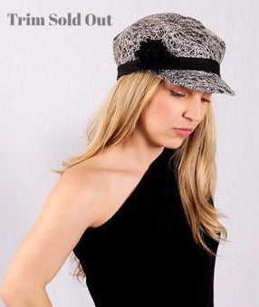 Woman wearing Valerie  Newspaper Boy  Style Cap in Luna in Black | Black Band with Floral Trim | Handmade by Pandemonium Millinery | Seattle WA USA