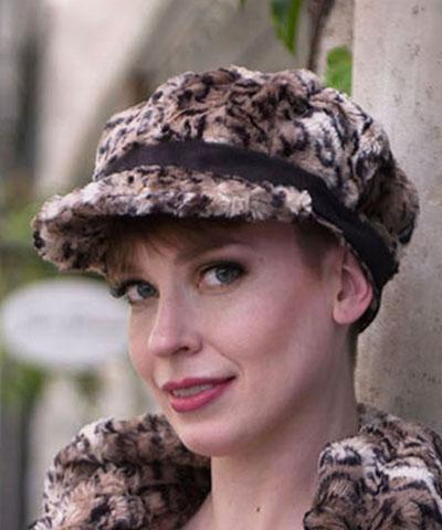 Model wearing  Valerie Cap Carpathian Lynx with Faux Suede Black Band by Pandemonium Millinery. Handmade in Seattle, WA USA.