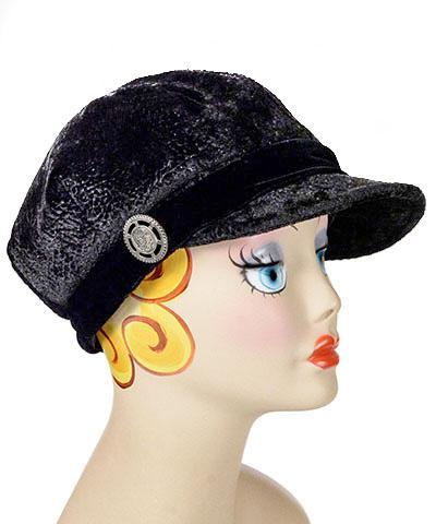 Model wearing a Valerie Cap Style  hat in Pebbles in Black with Black Velvet Band and Button handmade in Seattle, WA USA by Pandemonium Millinery.