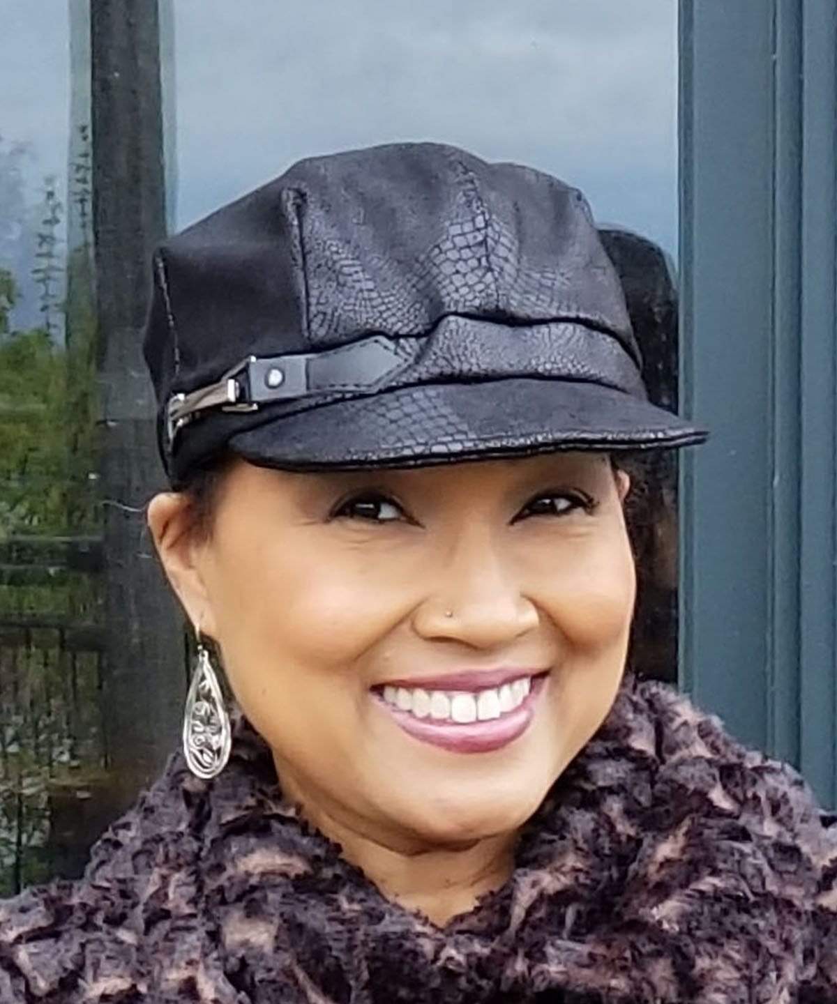 Woman wearing Valerie Cap in Outback in Back Faux Leather  with Italian Buckle Trim | Handmade in Seattle WA USA by Pandemonium Millinery