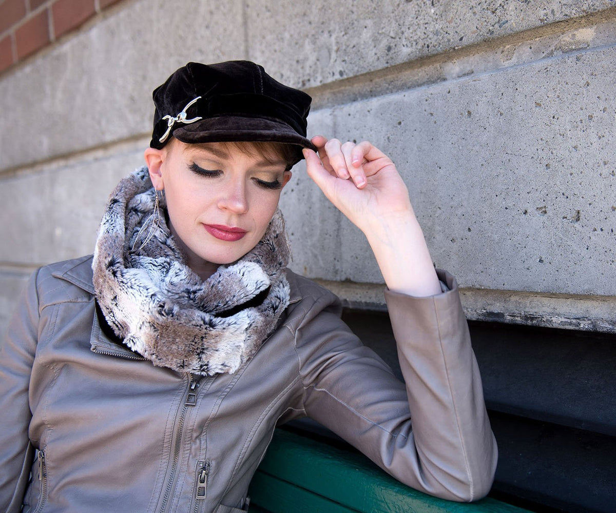 Woman sitting on a Bench  Valerie Style Cap Hat in Velvet in Chocolate | Nickel Buckle Trim | Birch  Faux Fur Neck Warmer Handmade by Pandemonium Millinery | Seattle WA USA