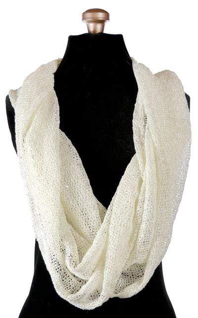 Women’s Wide Infinity Loop Scarf on Mannequin | Glitzy Glam in late, an open-weave knit with delicate sequins throughout in cream| Handmade in Seattle WA | Pandemonium Millinery