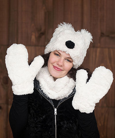 Woman modeling Bear Beanie Hat with ears and nose in Cuddly Ivory Faux Fur lined with Black. Handmade by Pandemonium Millinery.