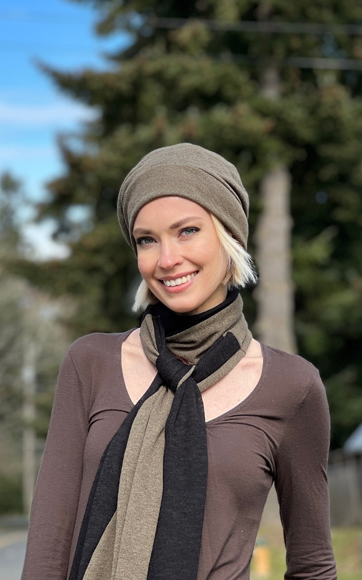 Woman wearing the Rowdie Hat in Mezcal. This Rowdie is made in soft crepe fabric. Handmade in Seattle, WA.