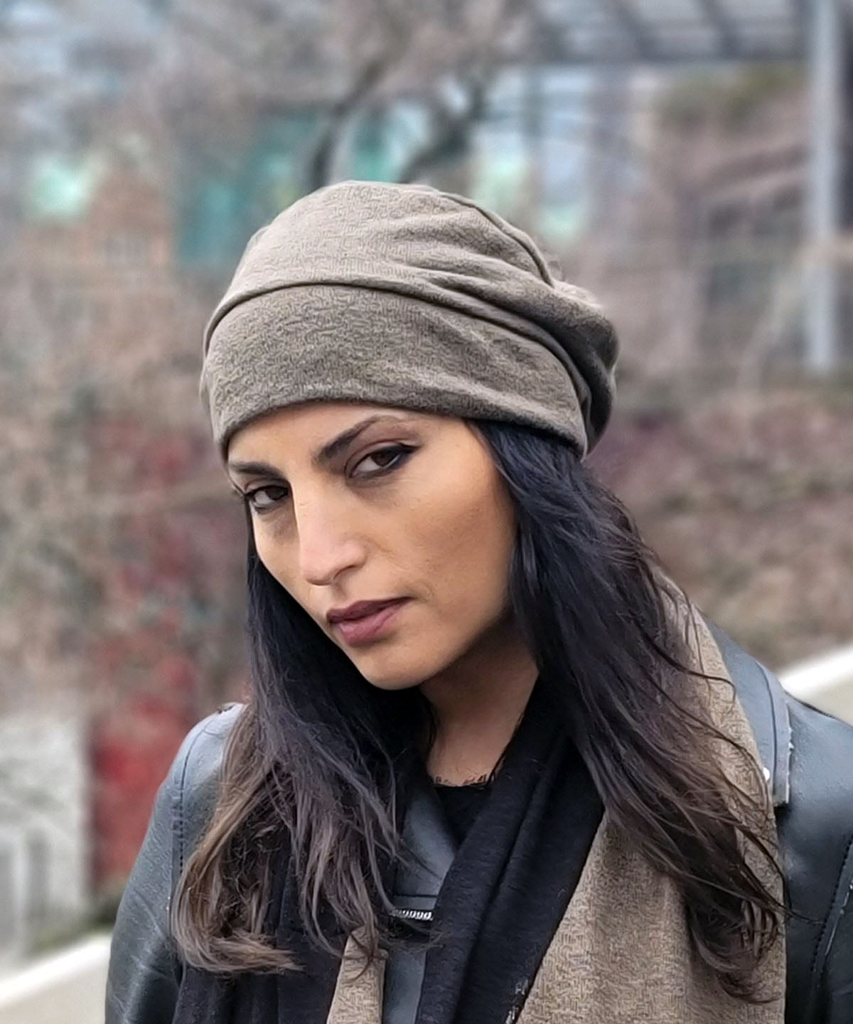 Woman wearing Rowdie Hat in Desert Crepe, color is Mezcal. Handmade in Seattle, WA.