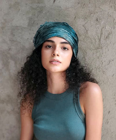 Rowdie Hat shown in Galactic Green on Model handmade in Seattle, WA USA by Pandemonium Millinery