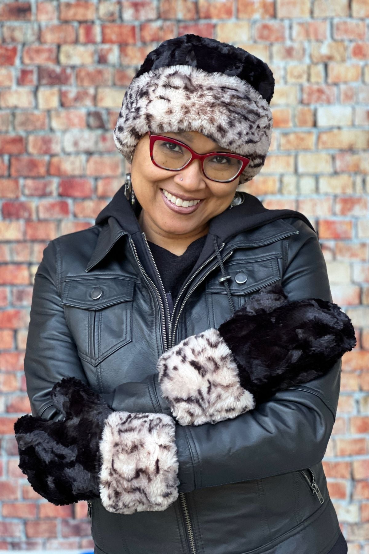 Model wearing is Mittens in Royal Opulence Snow Leopard by Pandemonium Seattle. Handmade in America