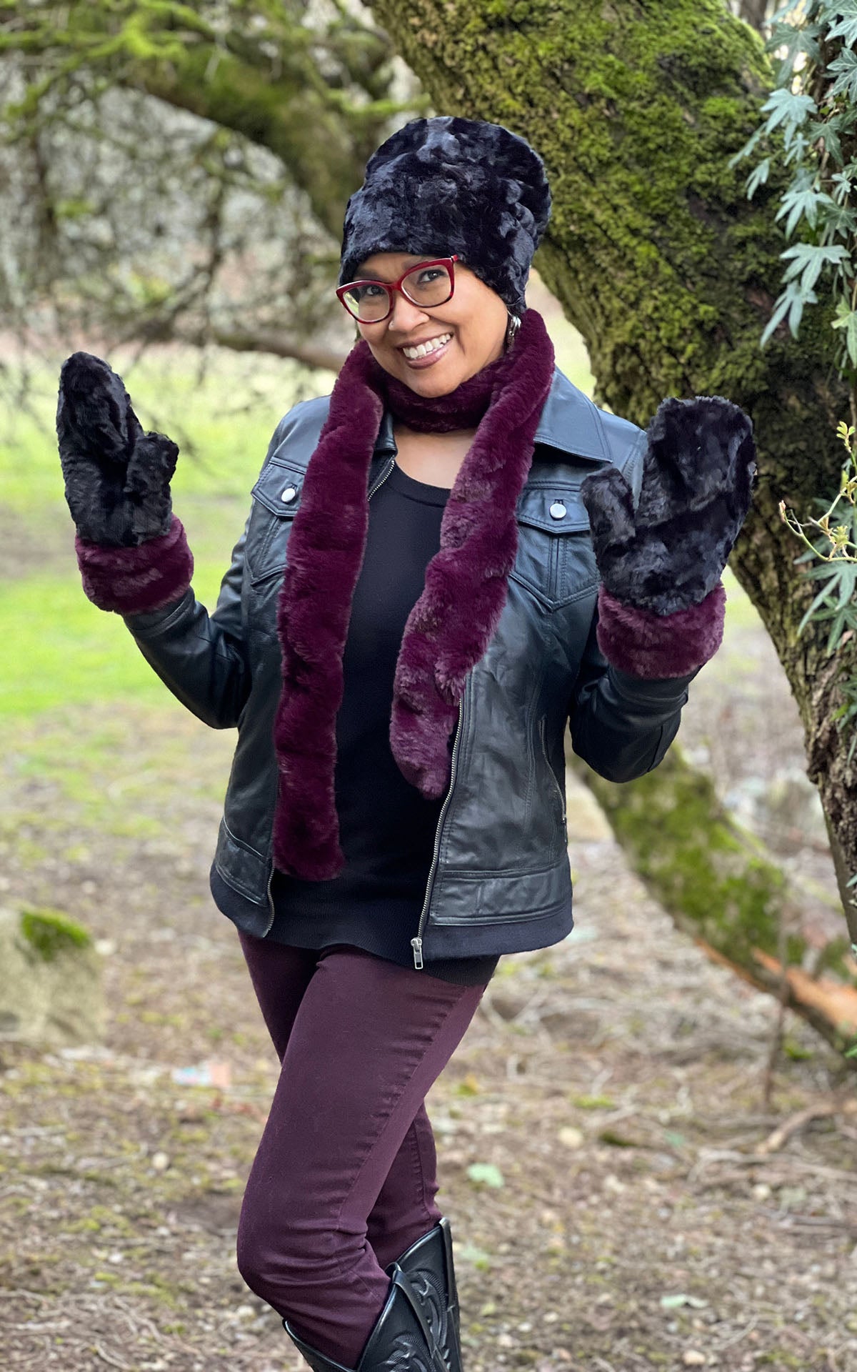 Woman wearing Royal Opulence Mittens with Merlot Cuffs and Cuddly Black, with matching Skinny Scarf in Merlot. Handmade by Pandemonium Seattle.
