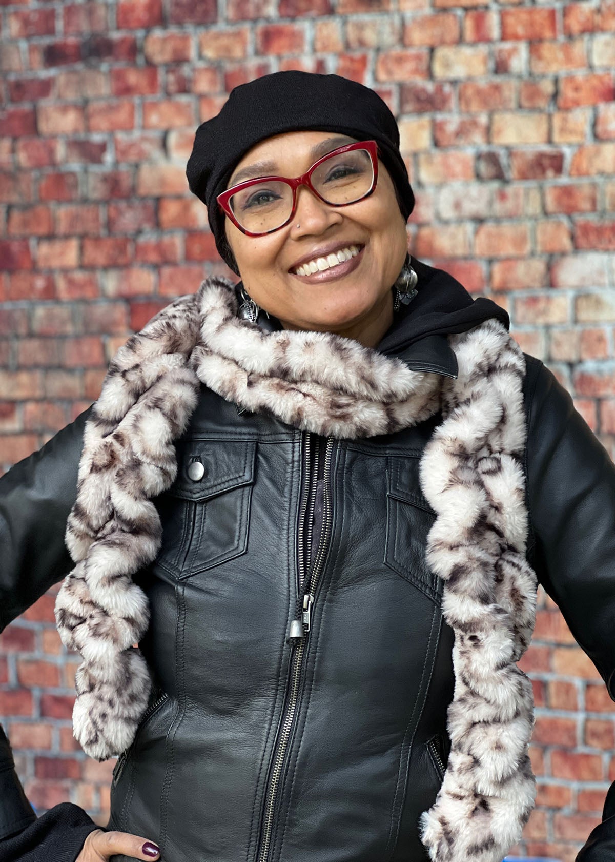 Woman wearing the Royal Opulence Skinny Scarf in Snow Leopard. Handmade by Pandemonium Seattle.