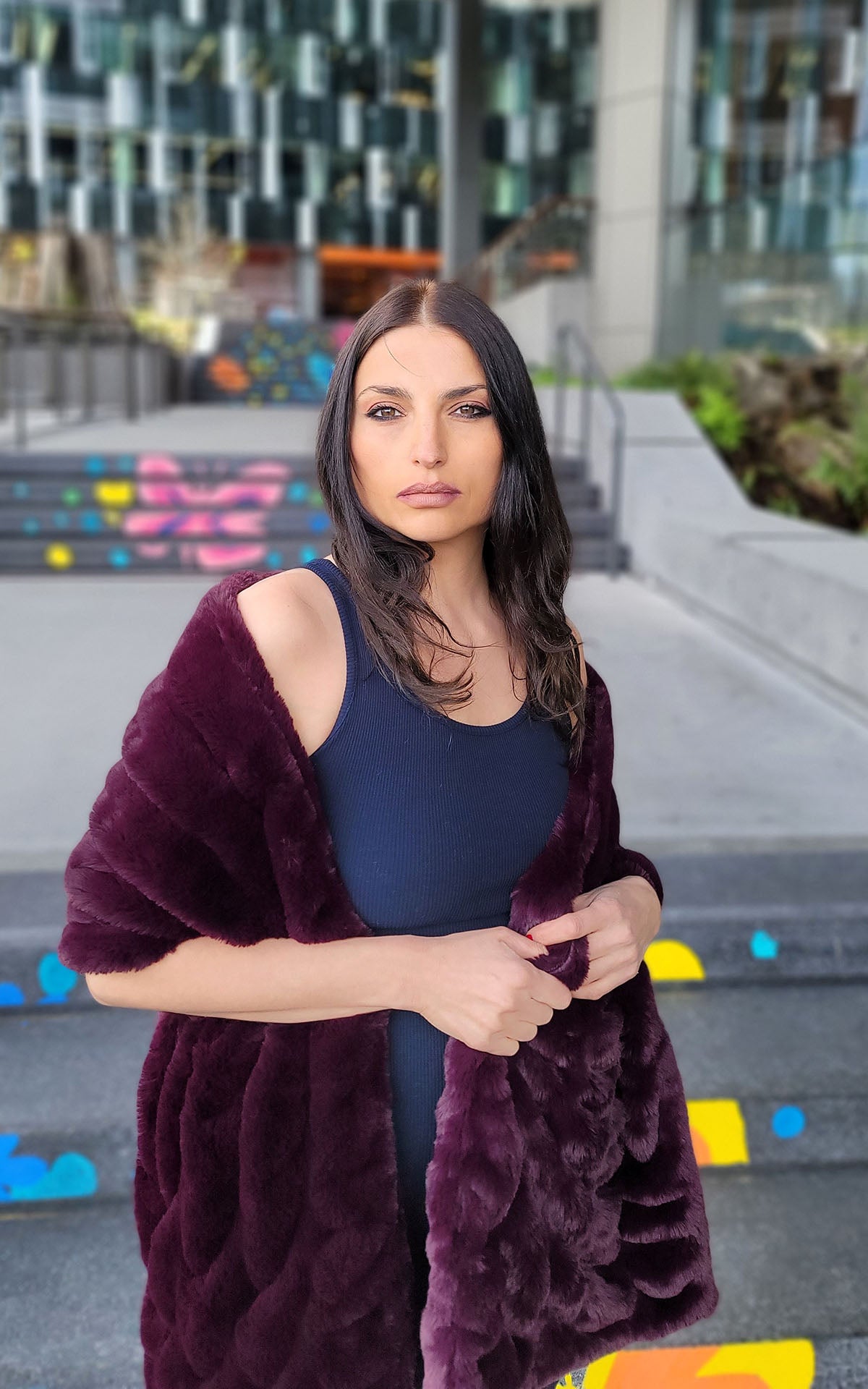 Woman wearing the Royal Opulence Stole in Merlot around her shoulders. Handmade by Pandemonium Seattle.