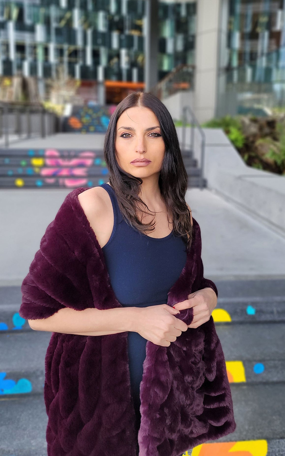 Woman wearing the Royal Opulence Stole in Merlot around her shoulders. Handmade by Pandemonium Seattle.