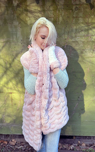 Woman wearing the Royal Opulence Stole in Rose. Handmade by Pandemonium Seattle.