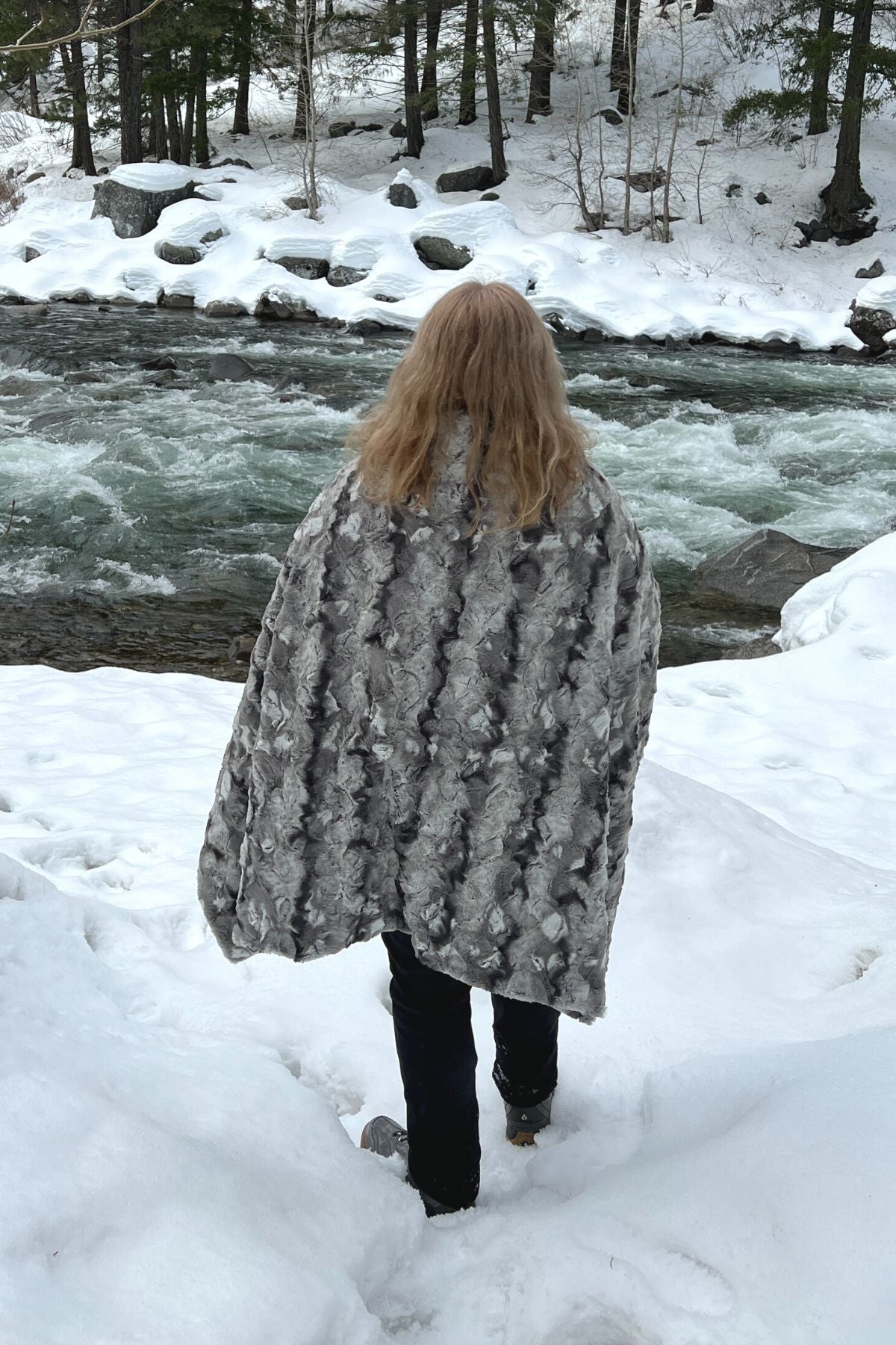 Throw Blanket on Woman Standing by Rapids | White Water Luxury Faux Fur | Handmade in WA, USA by Pandemonium Seattle