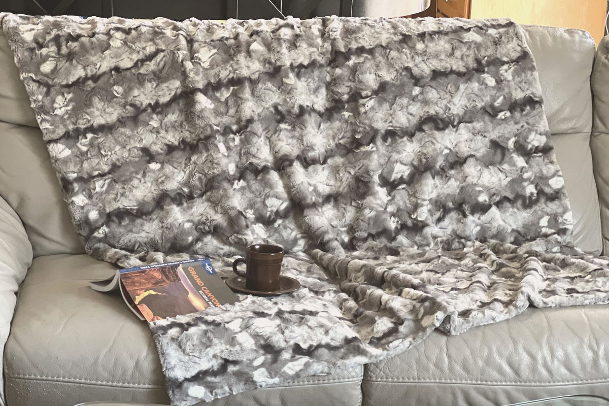 Throw Blanket draped on couch | White Water Luxury Faux Fur | Handmade in WA, USA by Pandemonium Seattle
