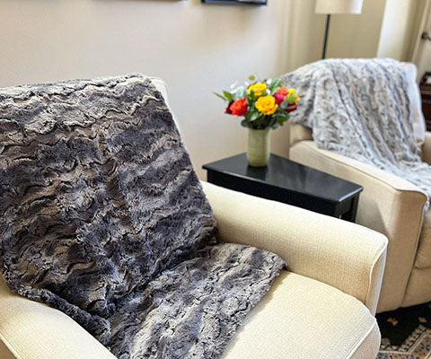 Blanket  on back of  Cream Chair in Muddy Waters; Black Brown and Gray | Luxury Faux Fur Throws | Handmade by Pandemonium Millinery